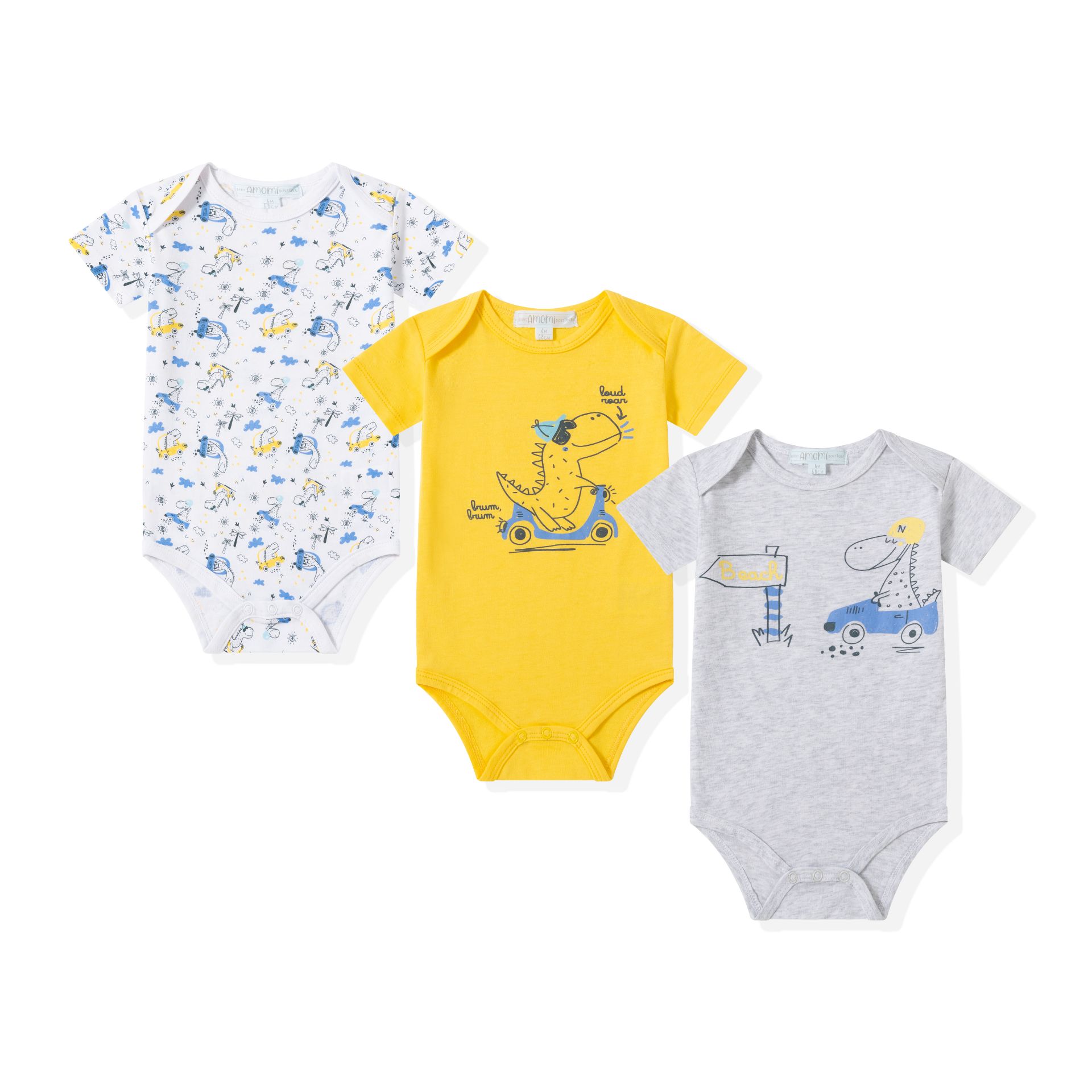 0021064_bodies-3-a-24-meses - Da-Da Kids Three children's t-shirts in pastel colors (white with blue-yellow dinosaur print, solid yellow with dinosaur graphic, light gray with vehicle doodles) laid out together, flat lay styling