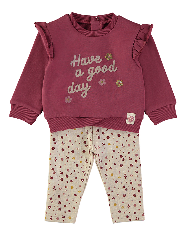 261050_000024_1 - Da-Da Kids Two-piece children's outfit: burgundy sweatshirt with ruffled shoulders and 'Have a good day' text, paired with cream leggings covered in small pink and yellow flowers.